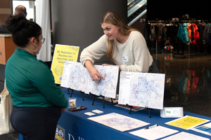 Community Partnership photo with woman showing a chart