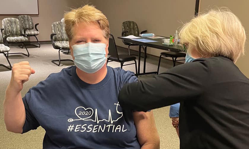 Woman getting COVID-19 vaccine.