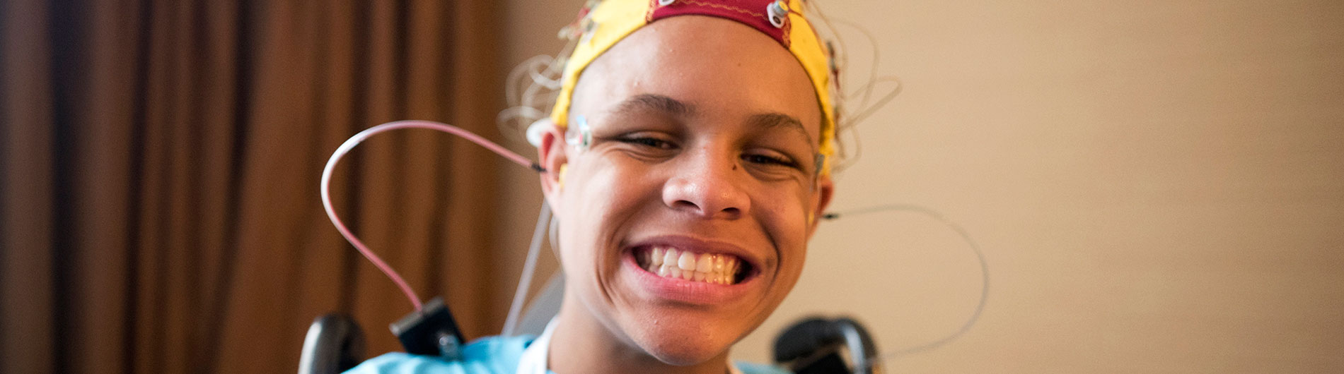 Smiling subject in EEG cap