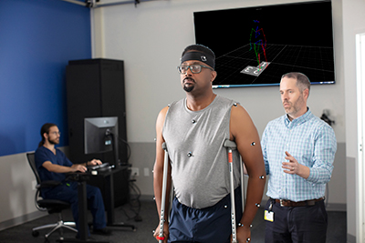 Patient with provider will performing degenerative spine and musculoskeletal test.