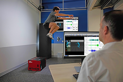 Patient doing a jump for a sports performance testing.