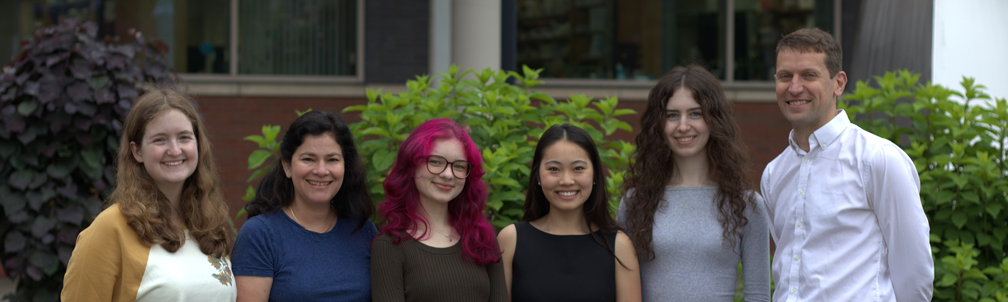Mackenzie Lab Members Posing for a Photo Outdoors
