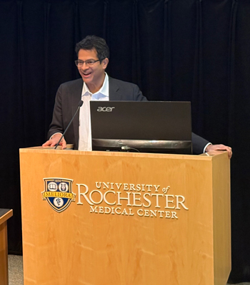 Dr. Mootha at podium