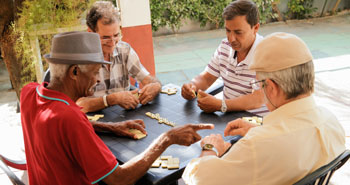 latino men playing cards