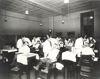 Dental Interns providing patient care, 1920's.