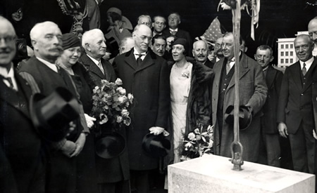 Queen Elisabeth with Dr. and Mrs. Harvey Burkhart in a group