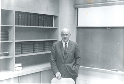 Dr. Bibby at the front of a classroom.
