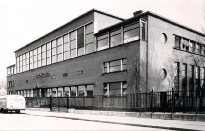 Exterior of Paris clinic with bus that took children to and from clinic