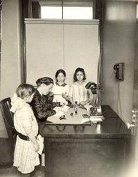 Three children with appointment secretary.