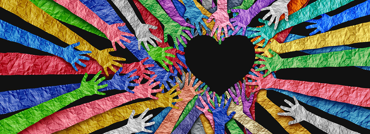 Community group hands extended in unity connected around shape of a heart