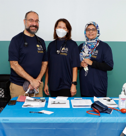 Joseph Nicholas, MD, MPH, Kathleen McCullough, NP, and Aameera Khan, MD, FACP, at the Barakah Muslim Charity Event in 2022
