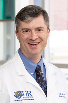 Carl 'Chris' Reynolds, M.D., F.A.C.P., F.H.M., HEC-C