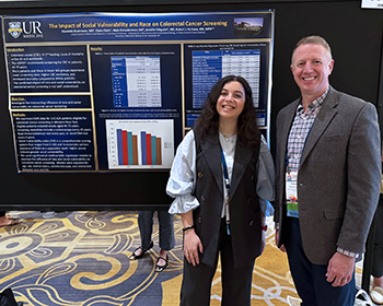 Charlotte Blumrosen, MD, and Robert Fortuna, MD, with their poster.