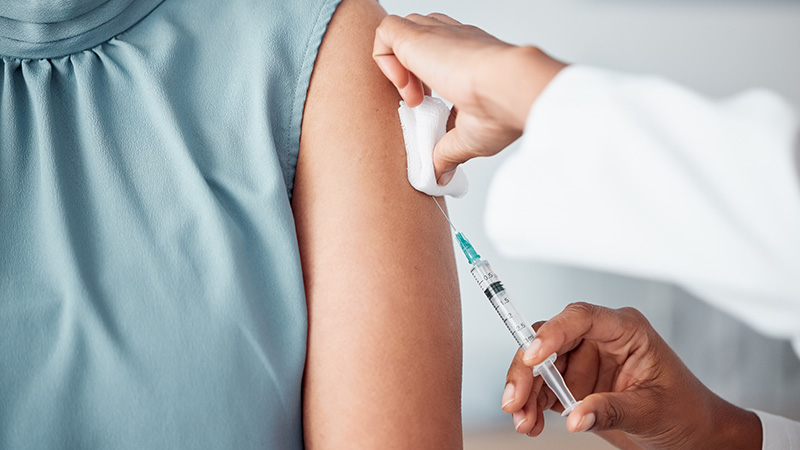 a person receiving a shot from a doctor