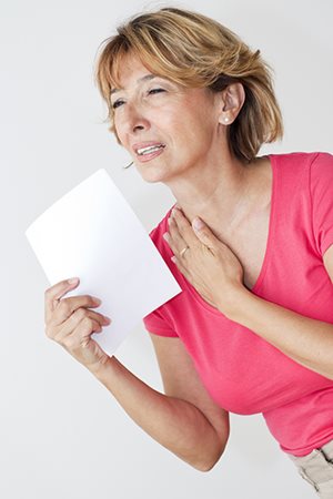 Woman fanning herself