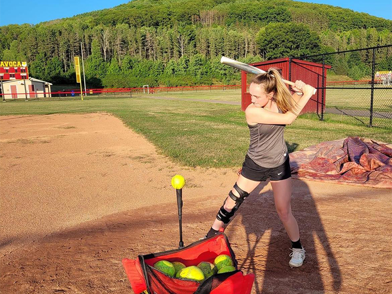 Jordan Swift Hitting Softballs Off of a Tee