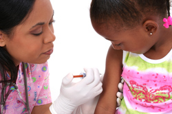 Nurse giving a child an immunization