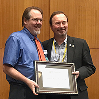 Receiving Award, Director of the Hoekelman Center, Dr. Andrew Aligne, with Chair of the Department of Pediatrics Dr. Patrick Brophy.