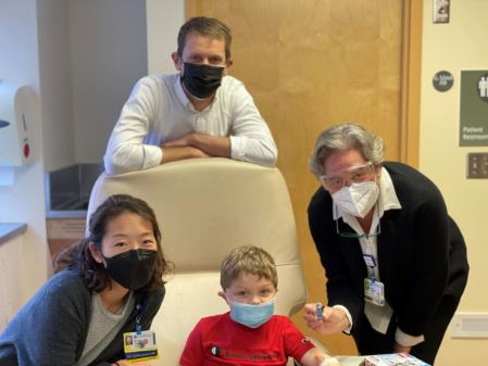 Peds fellows with young patient