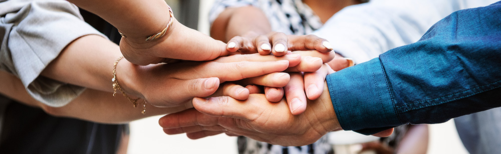 group of hands showing collaboration