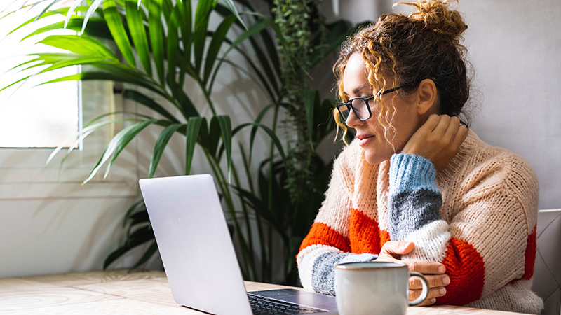 woman watching webinar on laptop