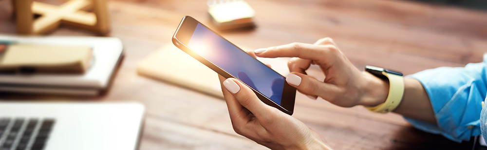 women tapping mobile photo