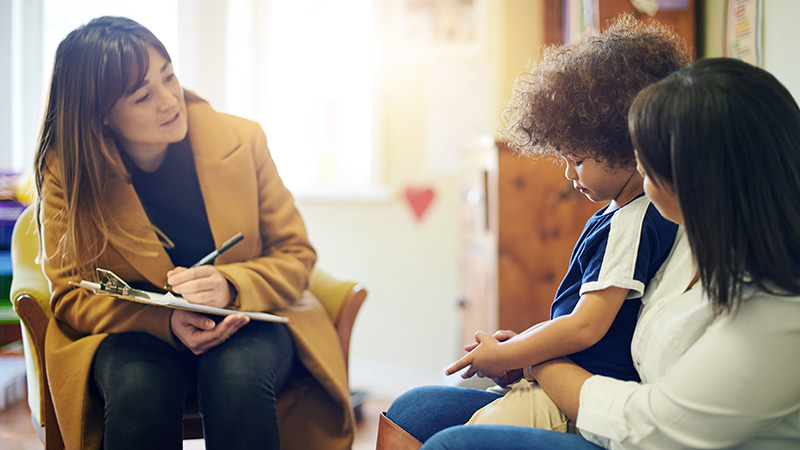 counselor talking with child and parent