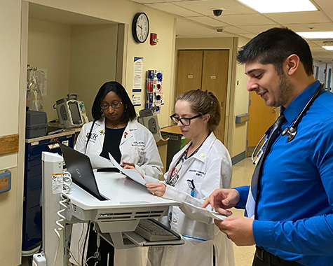 Team of doctors reviewing patient charts