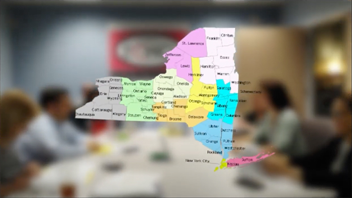 Map of NY state with people in the background
