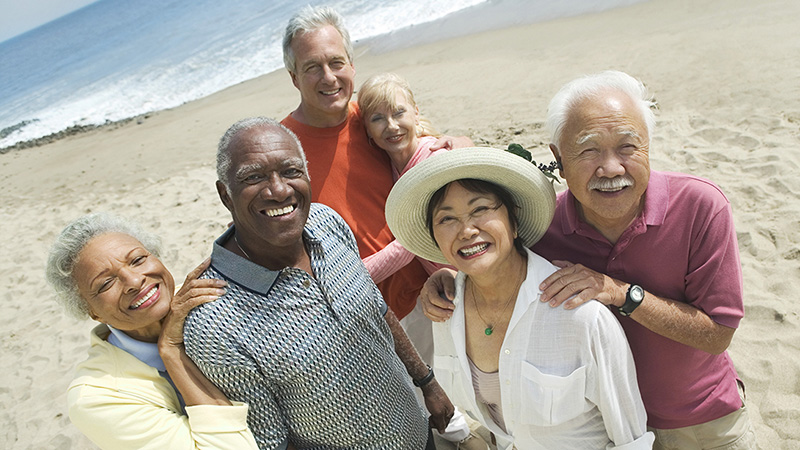 group of older adults on a beach