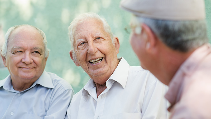 group of older men talking