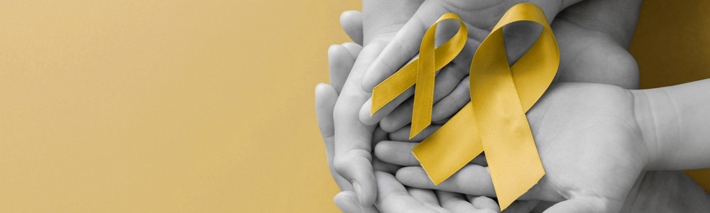 yellow ribbons with hands to symbolize suicide prevention