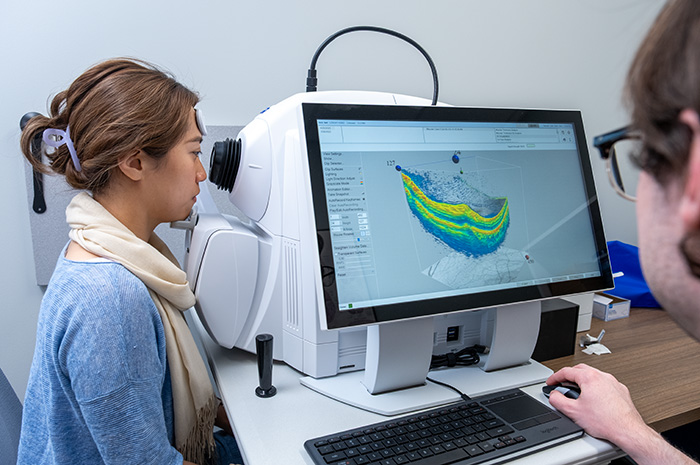 A woman having her eye scanned