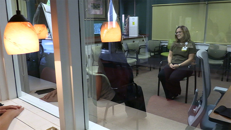 person looking into observation room
