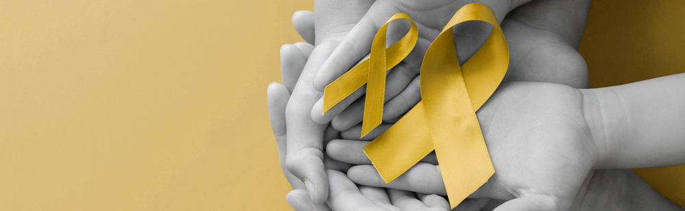 yellow ribbon with hands holding underneath