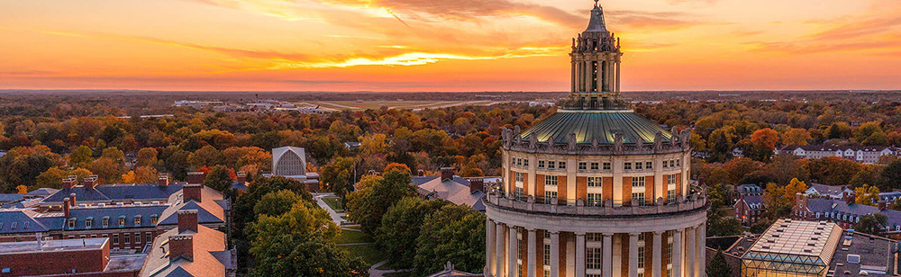 aerial view of the university of rochester showing library tower and sunset