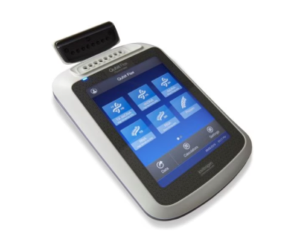 Qubit Flex Fluorometer with lid open exposing the 8 individual chambers for qubit tubes to be placed. Screen is on and contains the menu buttons that are present on the Qubit home screen.