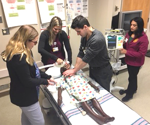 Nursing professional development students utilize new life-saving training equipment in the classroom.