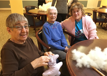 Volunteers at Willow Ponds in Penfield, NY gather to hand-make stuffed teddy bears for children at Golisano Children's Hospital at Strong Memorial Hospital.