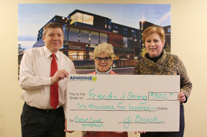 Advantage FCU URMC Branch Manager, David Samuelson, presents a $1,500 check to Friends of Strong Council President, Rose Faucette, and Director, Sandy Arbasak