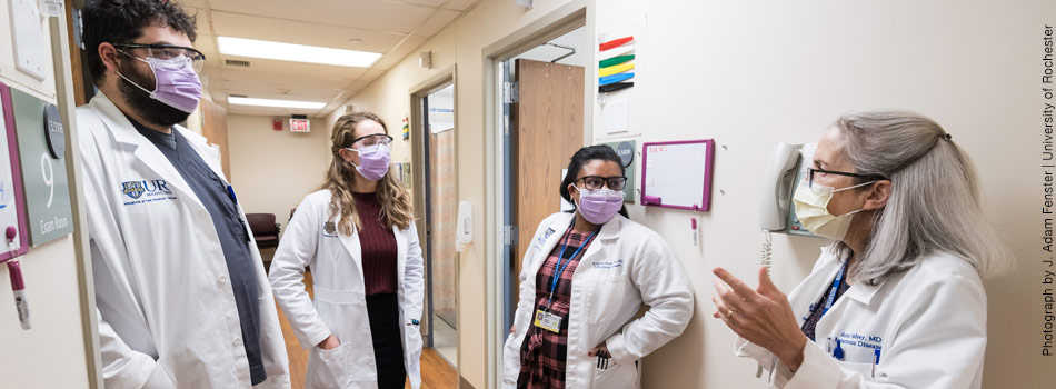 Ann Falsey, M.D. (R) and Angela Branche, M.D., (C) are pictured with Ian Shannon, RN (L) and project coordinator Sarah Northup (2L) in the Infectious Diseases Research Clinic.