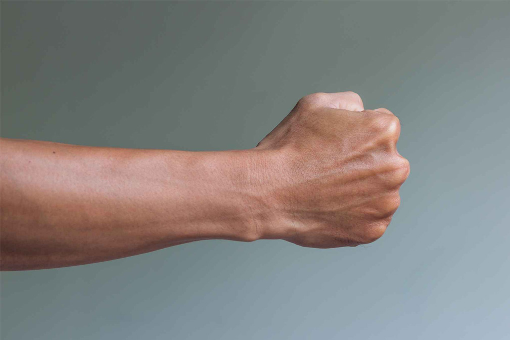 Photo of arm with clenched fist