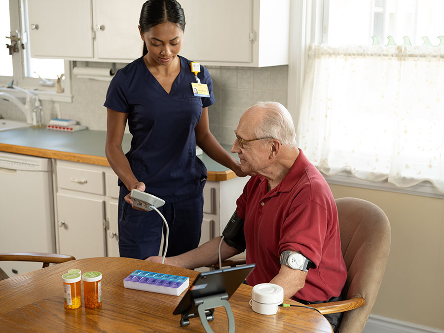Nurse working with at home patient