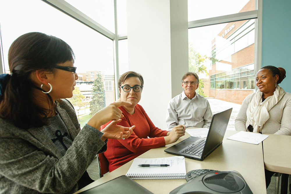 UR Medicine Researchers Meeting in a Conference Room