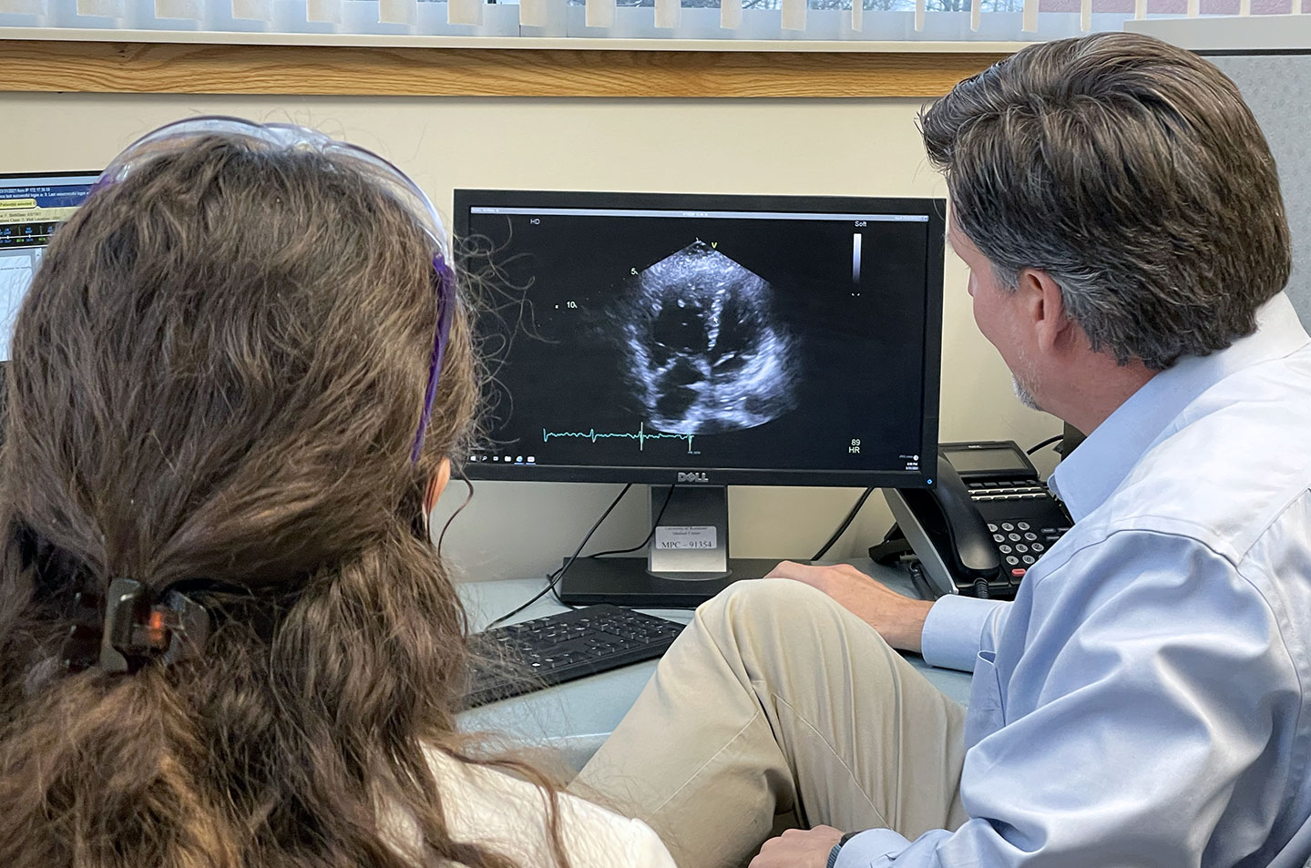 Dr. Jim White reviews pulmonary hypertension case with staff scientist Allison Mills