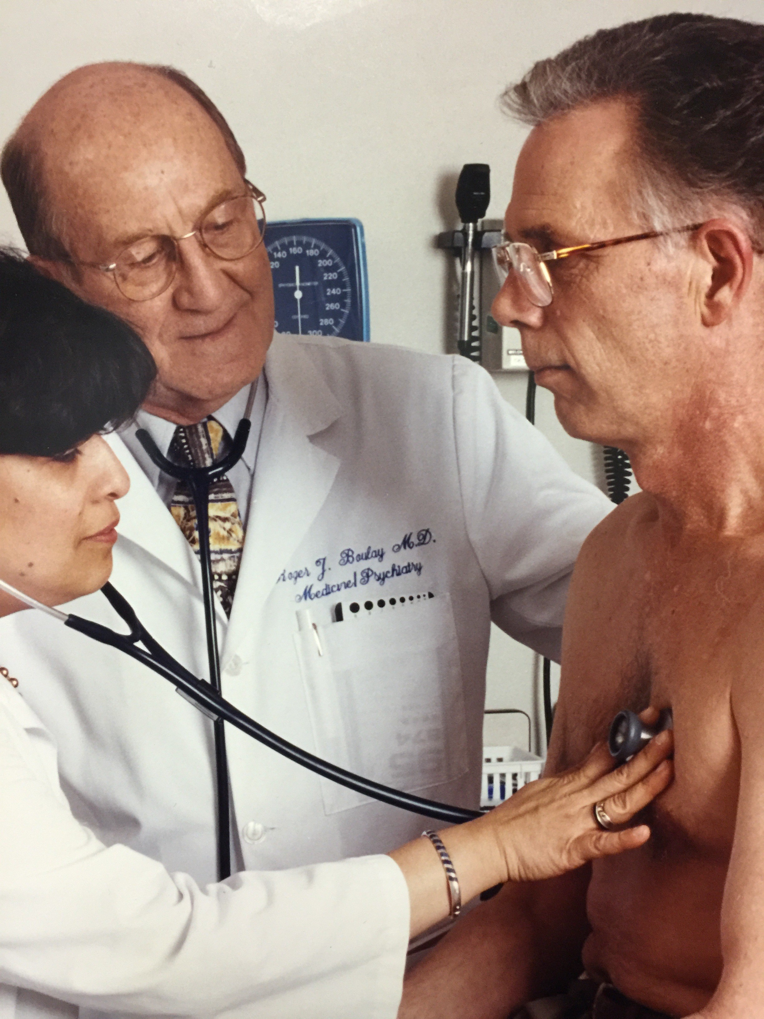 Roger Boulay and Telva Olivares examining a patient