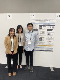 Amy Hong Standing with Her Poster