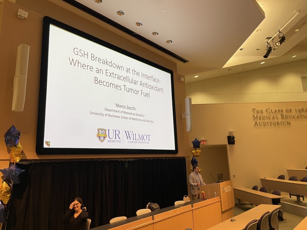 Lecture hall showing thesis defense presentation slide