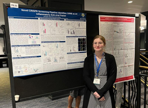 Nicole Waild in front of poster