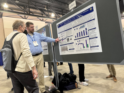 Nick Rugelis presenting with poster
